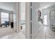 Hallway with views of a bathroom and a bedroom. Neutral color palette at 3181 Bayview Ln, St Cloud, FL 34772