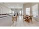 Open layout kitchen features a bar with seating and views of the dining area and living room at 3181 Bayview Ln, St Cloud, FL 34772