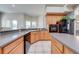 Traditional kitchen featuring wood cabinets, a breakfast bar, and sleek countertops with lots of space at 3181 Bayview Ln, St Cloud, FL 34772