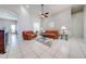 Open-concept living room with tile flooring and leather sofas at 3181 Bayview Ln, St Cloud, FL 34772