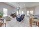 Spacious living room featuring vaulted ceilings, tile floors, and breakfast bar seating at 3181 Bayview Ln, St Cloud, FL 34772