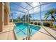 Enjoy this screened-in pool with lake views, surrounded by lush landscaping and bright sunlight at 3181 Bayview Ln, St Cloud, FL 34772