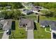 Aerial view of home featuring solar panels, fenced yard, and green landscaping at 341 Gardenia Ct, Kissimmee, FL 34759