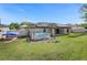 Expansive backyard featuring a pool, patio, and solar panels for energy efficiency at 341 Gardenia Ct, Kissimmee, FL 34759
