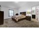Comfortable bedroom with plush carpet and view to bath at 341 Gardenia Ct, Kissimmee, FL 34759