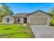 Charming single-story home with a well-maintained lawn and inviting curb appeal at 341 Gardenia Ct, Kissimmee, FL 34759