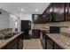 Kitchen featuring granite countertops, tile backsplash, and stainless-steel appliances at 341 Gardenia Ct, Kissimmee, FL 34759