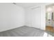 Bright bedroom features modern closet doors and neutral gray carpet at 3765 Deer Ridge Dr, Mount Dora, FL 32757