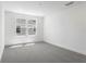 Spacious carpeted bedroom with large windows and plenty of natural light at 3765 Deer Ridge Dr, Mount Dora, FL 32757