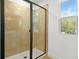 Modern shower with beige tile and black trim at 3765 Deer Ridge Dr, Mount Dora, FL 32757