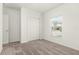 Neutral bedroom with carpet floors, window, and closet with bright walls at 4928 Worchester Dr, Kissimmee, FL 34746