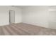 Clean carpeted bedroom with doorway and closet entrances and neutral decor at 4928 Worchester Dr, Kissimmee, FL 34746