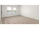 A spare bedroom features plush carpet, window views, and neutral wall colors at 4928 Worchester Dr, Kissimmee, FL 34746