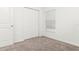 Neutral bedroom with carpet floors, window, and closet with bright walls at 4928 Worchester Dr, Kissimmee, FL 34746