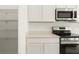 Close-up of kitchen with stainless steel appliances, an oven, and a well-organized pantry at 4928 Worchester Dr, Kissimmee, FL 34746