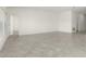 Expansive living area with tile flooring and neutral walls ready for personalization at 4928 Worchester Dr, Kissimmee, FL 34746