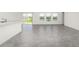 Open-concept living area with tile flooring and sliding doors showcasing a water view at 4928 Worchester Dr, Kissimmee, FL 34746