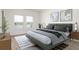 Tranquil main bedroom boasts water view, plush bedding, and stylish modern decor at 4928 Worchester Dr, Kissimmee, FL 34746