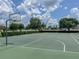 Full community basketball court with well maintained pavement and hoops at 6821 Cultivation Way, Winter Garden, FL 34787