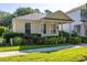 Charming single-story home featuring a quaint front porch, well-maintained landscaping, and a welcoming facade at 6821 Cultivation Way, Winter Garden, FL 34787