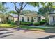 Lovely home with a manicured lawn and inviting curb appeal, complemented by mature trees and a sunny sky at 6821 Cultivation Way, Winter Garden, FL 34787