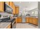 Well-equipped kitchen with stainless appliances, plenty of counter space, and a seamless flow into the dining area at 6821 Cultivation Way, Winter Garden, FL 34787