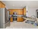 Spacious kitchen featuring stainless steel appliances, granite countertops, and ample cabinet space for storage at 6821 Cultivation Way, Winter Garden, FL 34787