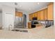 Functional kitchen layout with granite counters, stainless steel appliances, and abundant cabinet storage at 6821 Cultivation Way, Winter Garden, FL 34787