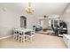 Open concept living and dining space featuring tile flooring and ample natural light, perfect for entertaining at 6821 Cultivation Way, Winter Garden, FL 34787