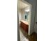Bathroom featuring a vanity, sink, a large mirror, and wood-look flooring at 7431 Cr 629, Bushnell, FL 33513