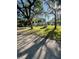 Charming single-story home with mature trees and a shed, set on a lush green lawn at 7431 Cr 629, Bushnell, FL 33513