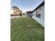 The green backyard is enclosed by a white vinyl fence with a covered patio visible at 748 Citrus Isle Dr, Davenport, FL 33837
