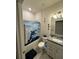 Cozy bathroom with granite countertop vanity and tiled floor at 748 Citrus Isle Dr, Davenport, FL 33837