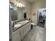 Bathroom featuring double sink vanity with granite countertop at 748 Citrus Isle Dr, Davenport, FL 33837