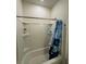 Bathroom shower/tub with blue curtain at 748 Citrus Isle Dr, Davenport, FL 33837