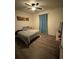 Standard bedroom with wood laminate floors, ceiling fan, and closet at 748 Citrus Isle Dr, Davenport, FL 33837