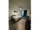 Spacious bedroom with two beds, ceiling fan, and wood-look flooring at 748 Citrus Isle Dr, Davenport, FL 33837