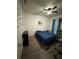 Cozy bedroom with laminate flooring and ceiling fan at 748 Citrus Isle Dr, Davenport, FL 33837