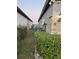 An air conditioning unit sits between two homes with lush landscaping, and brick accent at 748 Citrus Isle Dr, Davenport, FL 33837