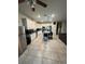 Spacious kitchen with stainless steel appliances, white cabinets, and island with bar stools at 748 Citrus Isle Dr, Davenport, FL 33837
