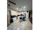 Bright and airy kitchen with white cabinets, granite countertops, and stainless steel appliances at 748 Citrus Isle Dr, Davenport, FL 33837