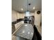 Kitchen featuring granite countertops, modern lighting, stainless steel appliances, and seating at the island at 748 Citrus Isle Dr, Davenport, FL 33837
