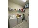 Spacious laundry room with appliances and storage shelves at 748 Citrus Isle Dr, Davenport, FL 33837