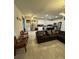 Open concept living area flows into modern kitchen with sleek stainless steel appliances at 748 Citrus Isle Dr, Davenport, FL 33837
