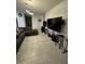 Comfortable living room with tile floors, neutral decor, and modern lighting fixtures at 748 Citrus Isle Dr, Davenport, FL 33837