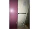 Bathroom featuring bronze hardware, a stone floor, and a mauve painted door at 781 W Lancaster Rd # B38, Orlando, FL 32809