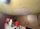 Stained ceiling with patched area above kitchen cabinets at 781 W Lancaster Rd # B38, Orlando, FL 32809