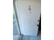 Exterior view of unit B-38's white front door with a doorbell at 781 W Lancaster Rd # B38, Orlando, FL 32809