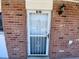 Exterior view of unit B-38 entrance, featuring a white security door at 781 W Lancaster Rd # B38, Orlando, FL 32809