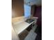 Kitchen sink with faux marble countertop, wood cabinets, and tile floor at 781 W Lancaster Rd # B38, Orlando, FL 32809